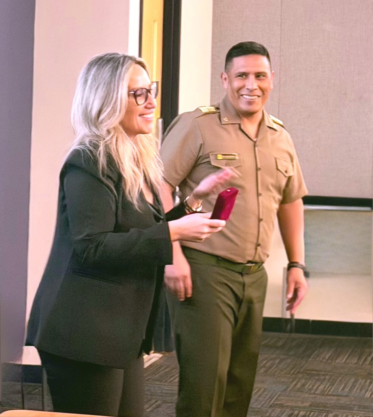 Jovianna Gonzalez with an officer of the Peruvian military delegation after the presentation