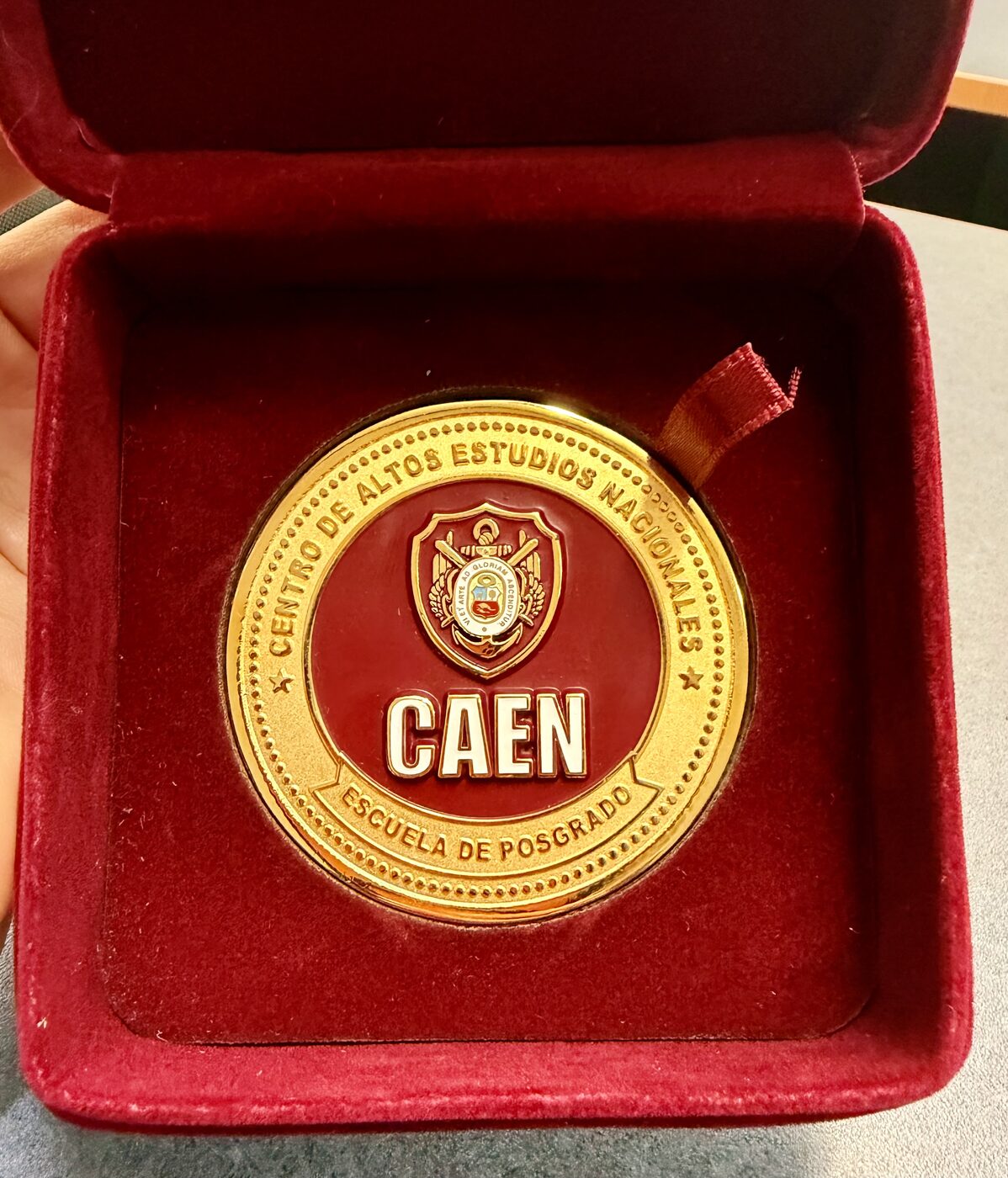 Commemorative medallion of Peru's Centro de Altos Estudios Nacionales in a presentation case