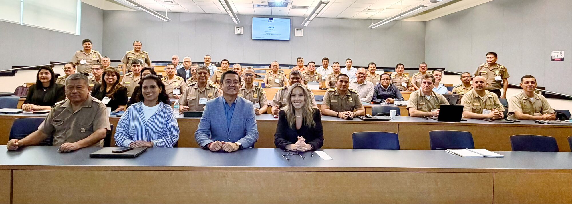 Jovianna Gonzalez with a Peruvian military delegation at a digital forensics presentation at Florida International University